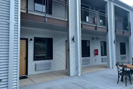 Location of suite.  Private entrance located on the back side of the building facing the pool.