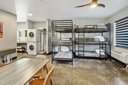 Yacht 2 
second floor
2 private queen bedrooms, full bathroom and kitchen. 6 bunkbeds, laundry, flexible living and dining area.