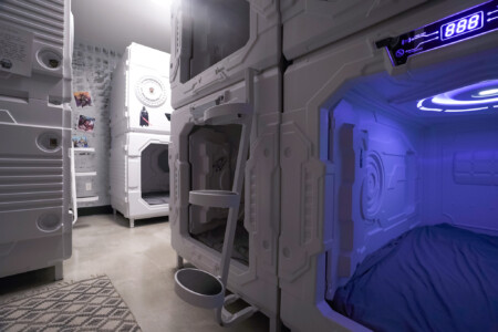 8 sleeping pods with a full bathroom.  Sleeping pods have lights and fans inside