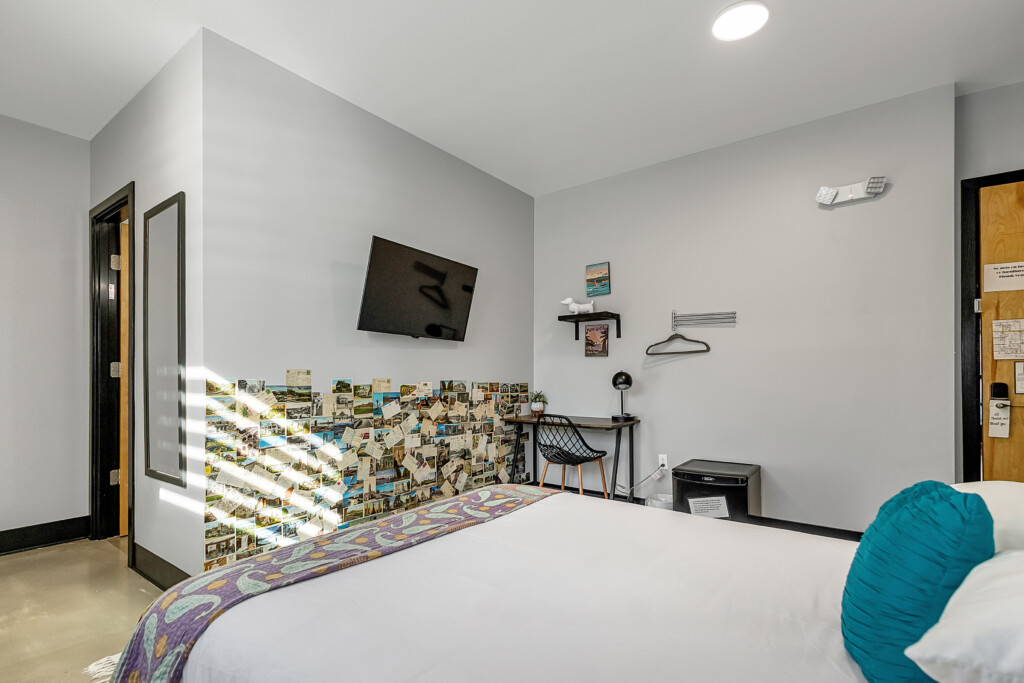 Queen room for 2 with half bath in room.  2 shower rooms located just outside room.